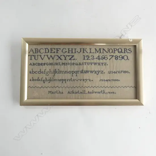 A framed antique sampler - Martha Arkistall, 1848.  315 x 155mm...